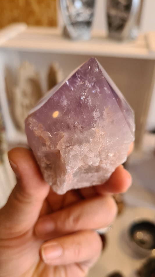 A range of crystals and sage on a heart shaped angel wing dish